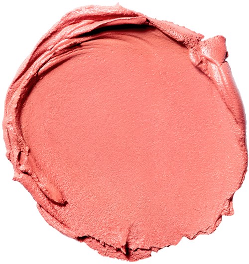 A round, pink makeup blush with a smooth, creamy texture and slightly rough edge.