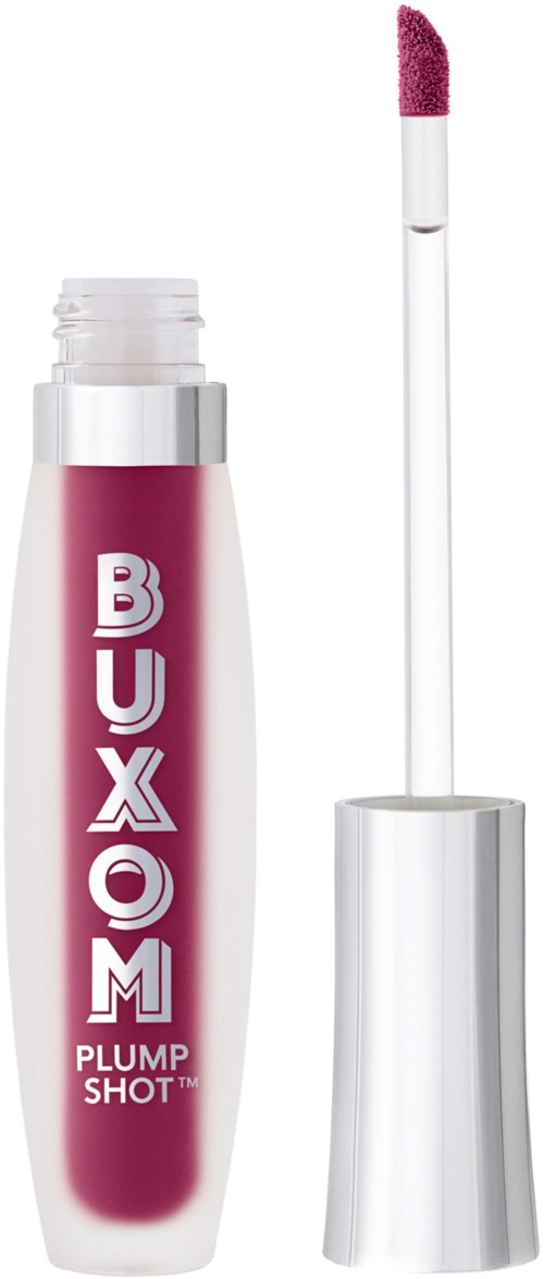 A pink lip gloss tube with a wand applicator showing. The label says 'BUXOM PLUMP SHOT' with the wand slightly pulled out.
