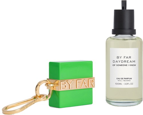 A perfume bottle, a green soap, and a keychain with a gold tag saying 'BY FAR'.