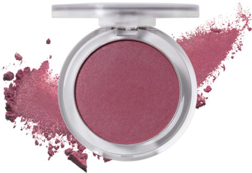 Ett rosa rouge i en rund behållare med en splash av rosa puder runt den.