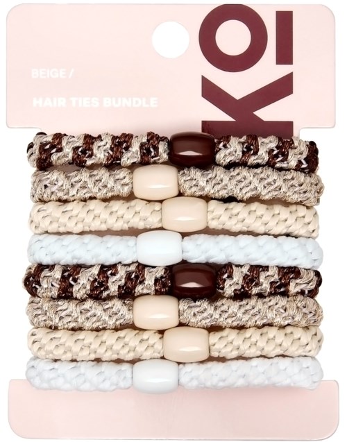 Set of eight beige and white hair tie bundles with braided and beaded designs.
