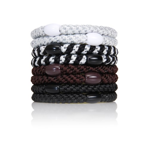 Stack of eight woven bracelets in white, black, gray, and maroon with beads.