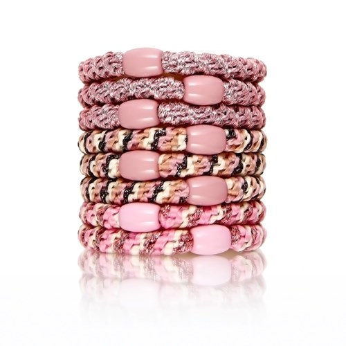 A stack of pink and patterned fabric hair ties with large pink beads, arranged in two groups.