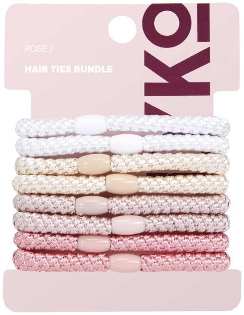 A bundle of eight hair ties in white, beige, and pink colors on a pink cardboard display.