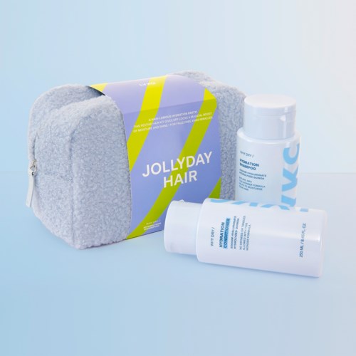 Haarverzorgingsset met een zachte handdoek, shampoo en conditioner in blauwe en witte flessen. Komt met een zachte grijze tas.