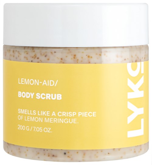 Ein Behälter mit Lemon-Aid Körperpeeling mit gelbem Etikett, beschreibt Duft und Größe, mit weißem Deckel.