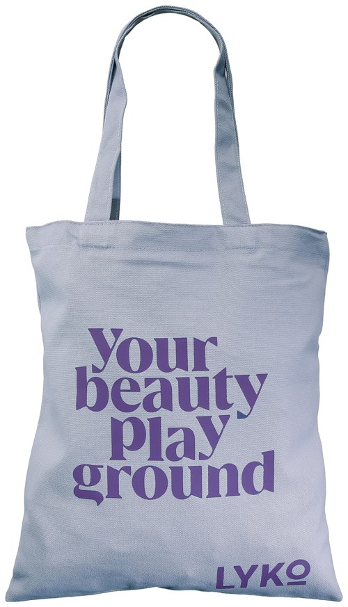 Een witte canvas tas met paarse tekst die zegt "Your beauty playground LYKO".