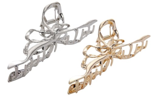 Two butterfly-shaped hair clips, one silver and one gold, with the word 'boss' integrated into the design.