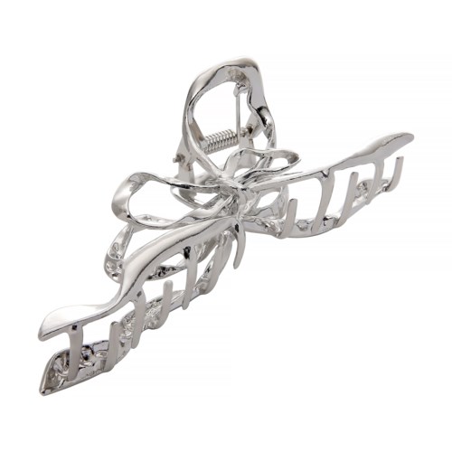 A silver hair clip with a bow and the word 'beauty' in cursive design.