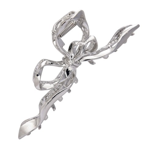 A shiny silver hair clip with a bow-like shape and decorative details.