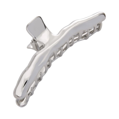 Een glanzende, metalen haarspeld met tanden en een scharnier voor openen en sluiten.