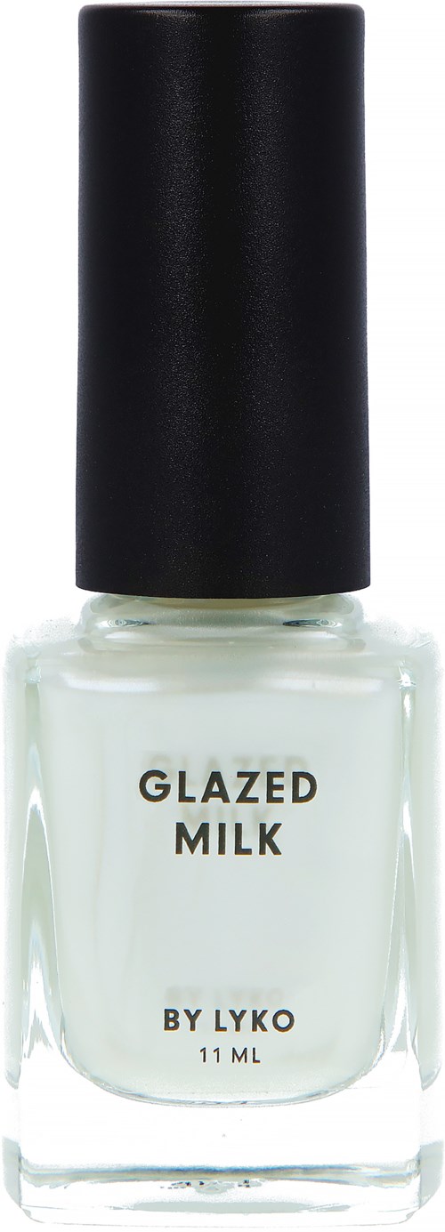 A small glass bottle of nail polish with white liquid, black cap, and label reading 'Glazed Milk by Lyko'.