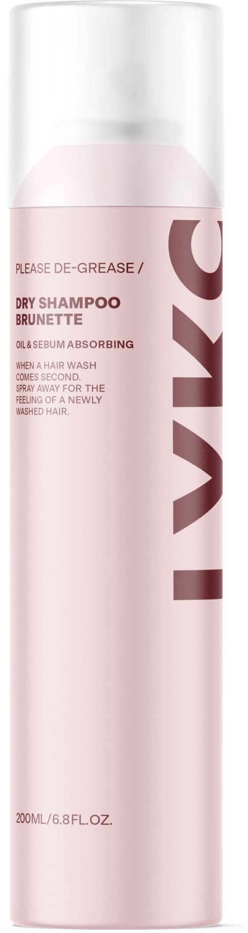 A tall, pink bottle of dry shampoo for brunettes with a white cap and bold brown text.