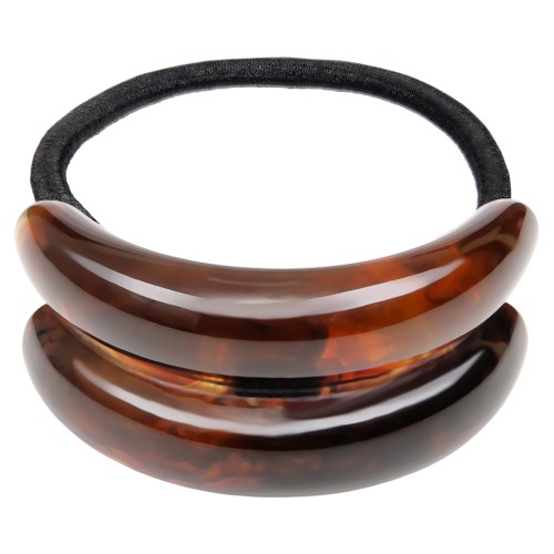 A hair tie with a tortoise shell design and two large, curved, brown plastic pieces.