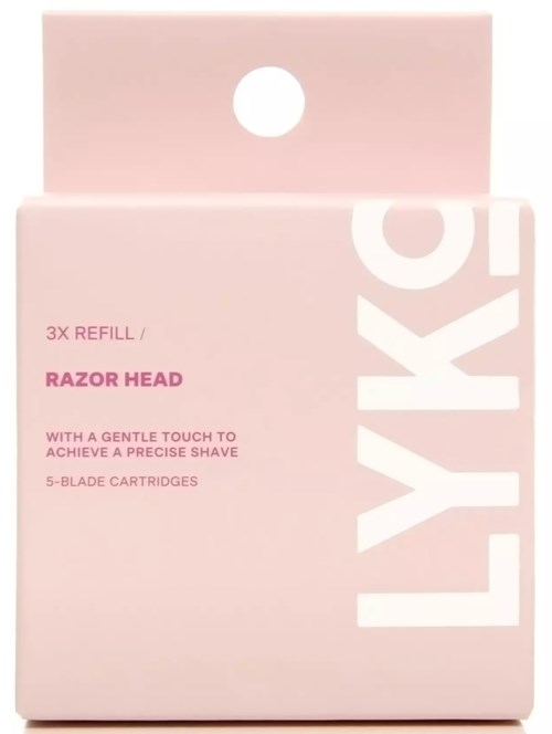 Pink box with white writing, showing a razor head refill package containing five cartridges.