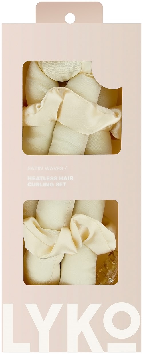 A set of three soft, cream-colored fabric bundles inside a pink and white box, probably a skin care or body product kit.