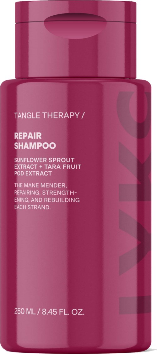 Een roze fles Repareer Shampoo met zonnebloem-, tara-fruit extract en versterkt het haar.