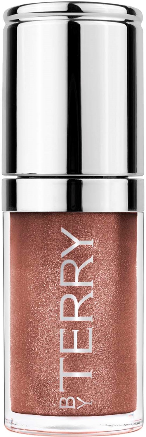 Nailpolish-flaska med lock, märkt BY TERRY, i en glänsande silverbehållare och beige färg.