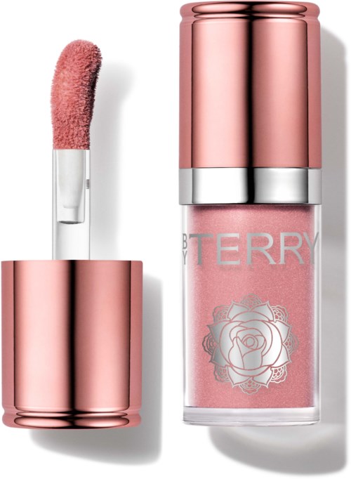 Läppglans i rosa med applikator och matchande rosa lip gloss-flaska med ros-tryck.