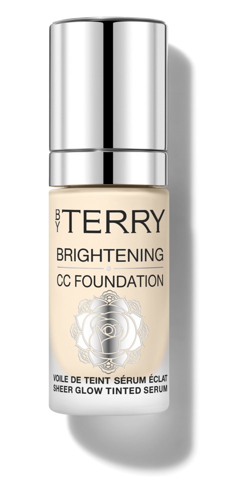 A small bottle of BY TERRY Brightening CC Foundation with a silver cap and a white label with gold and black text.