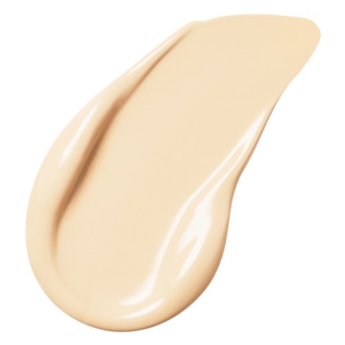 A beige-colored cream or lotion with a smooth, thick texture and a slight sheen.