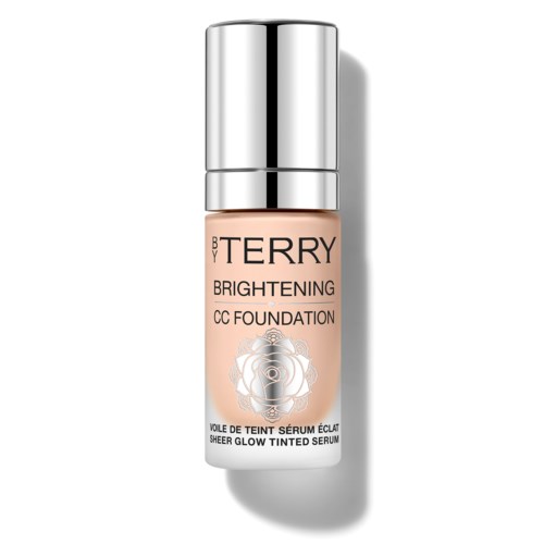 A cosmetic bottle labeled 'BY TERRY Brightening CC Foundation' with a silver cap and a rose logo.