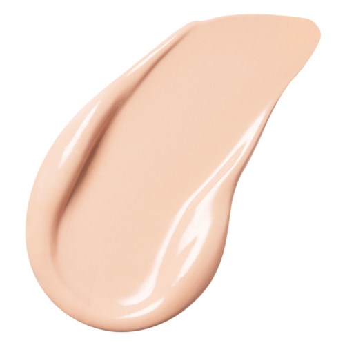 A drop of beige-colored liquid, smooth and shiny, with a pointed tip and rounded base.