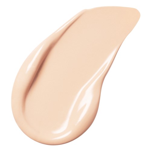 A beige-colored liquid foundation or cream with a smooth, glossy texture shaped like a teardrop.