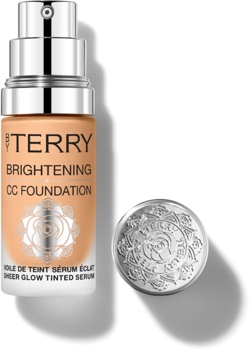 Brightening CC Foundation bottle with rose design and a round lid beside it.