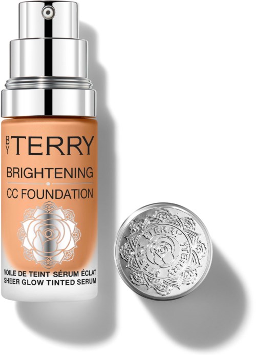 A bottle of BB Terry brightening CC foundation with a silver pump and a closed silver lid with design.