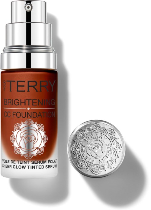 A bottle of BB cream with a silver cap and a round silver container next to it. The labels are red and silver.