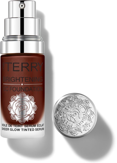 A brown bottle of Terry Brightening BB Foundation with a silver pump and a separate silver lid.