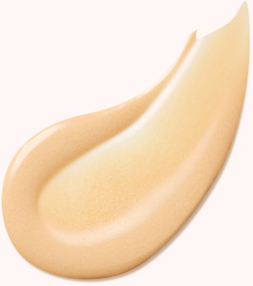 Kermainen beauty blender, pisaramainen, sileä pinta ja pyöreät reunat.