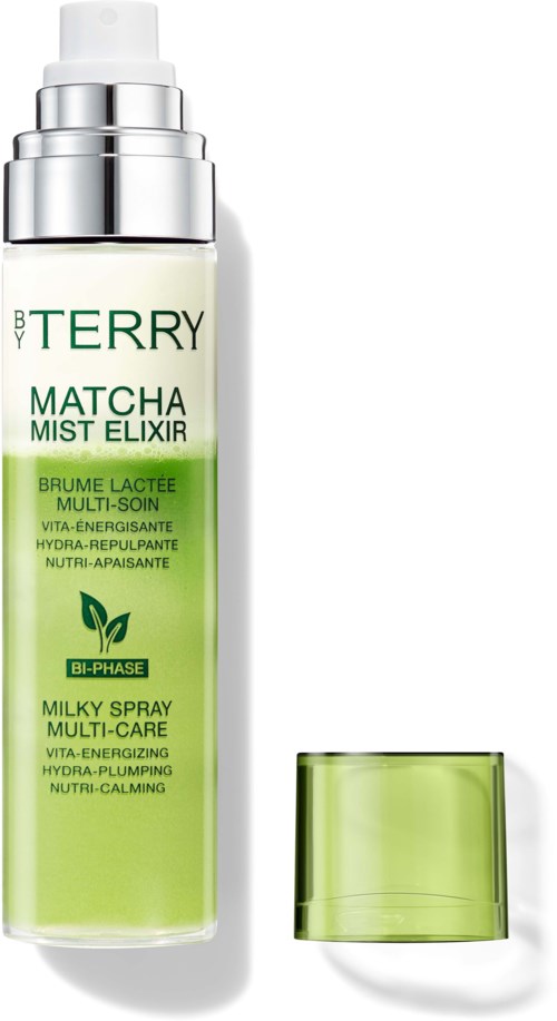 En grön- och vit flaska matcha mist elixir med ett transparent grönt lock bredvid.