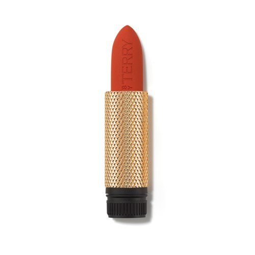 A lipstick with a gold textured case and red lipstick inside. The lipstick has the word "STRAWBERRY" on it.