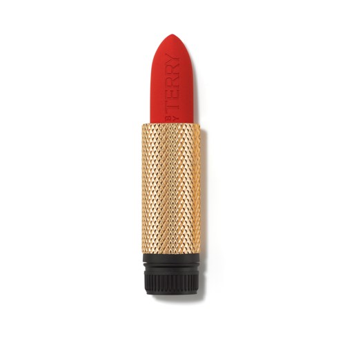 A lipstick with a red color and a gold textured case, shaped like a flower, standing upright.