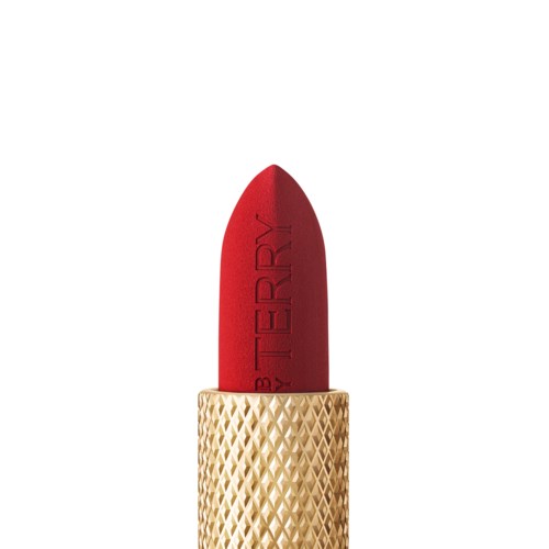 A red lipstick in a gold textured tube. The lipstick is extended and upright.
