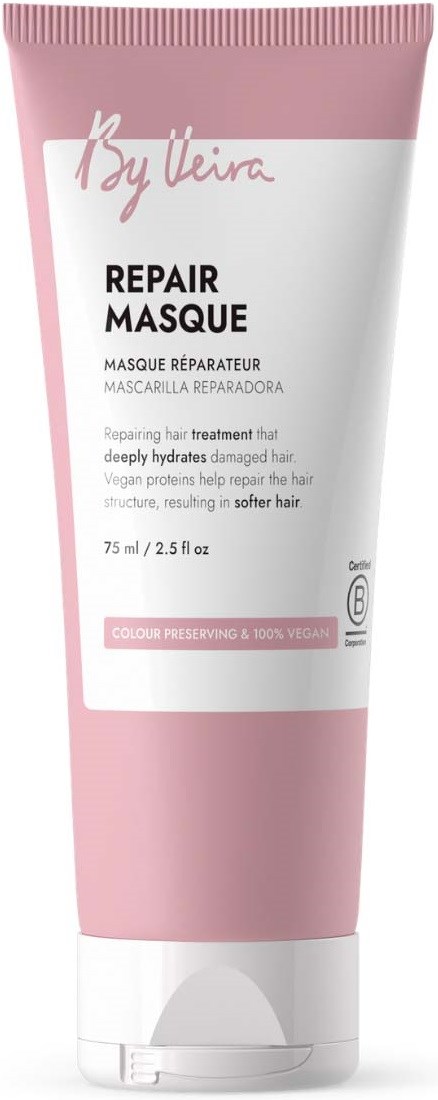 Pink tube av reparerende hårmaske med hvit etikett og tekst som sier Repair Masque.