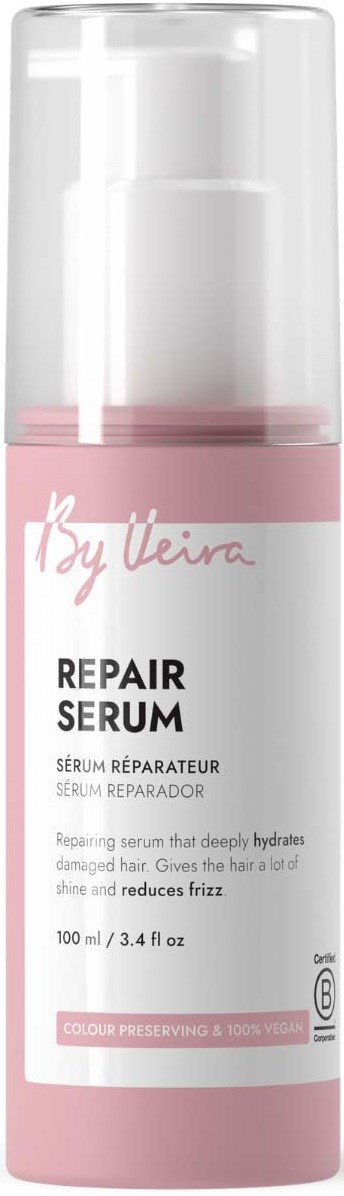 A pink and white bottle of repair serum for hair, with a clear cap and pump, labeled by By Ueira.