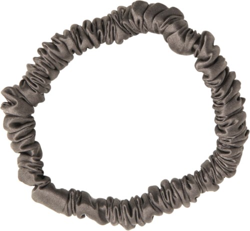 A grey fabric hair band with elastic, gathered and stretchy for wearing around the head.