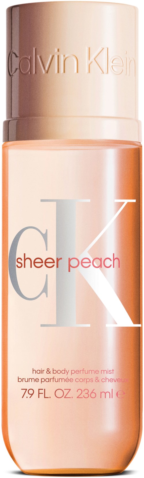 Een perzikkleurige Calvin Klein-parfumfles met label 'sheer peach' voor haar en lichaam.