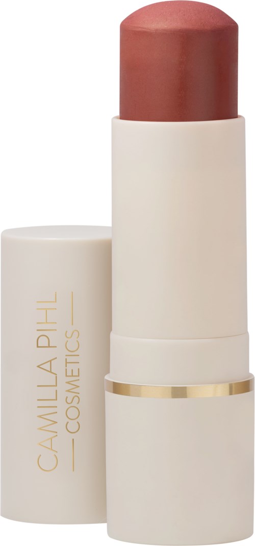 Ein beigen Lippenstift mit goldenem Band und Markenname Camilla Phil Cosmetics auf der Seite.