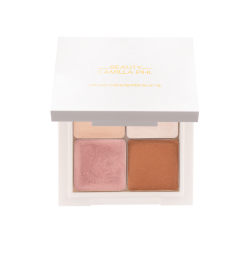 Pieni meikkipaletti, jossa on neljä väriä: pinkki, beige, vaalea ja oranssi. Laatikossa kultateksti.