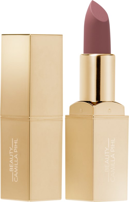 A gold-colored lipstick case with the lipstick partially extended, showing a pinkish hue. The case has a sleek, shiny surface.
