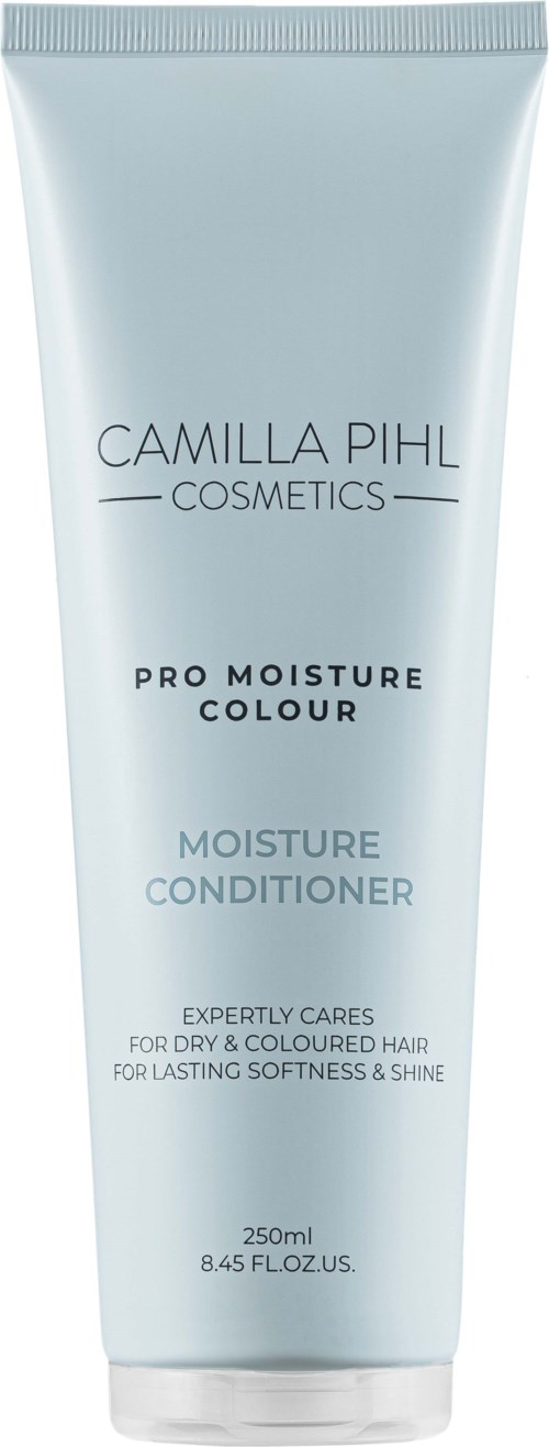 Valkoinen tuubi, jossa lukee Camilla Pihl Cosmetics Pro Moisture Colour Moisture Conditioner, sisältäen tuotteen nimen ja kuvauksen.