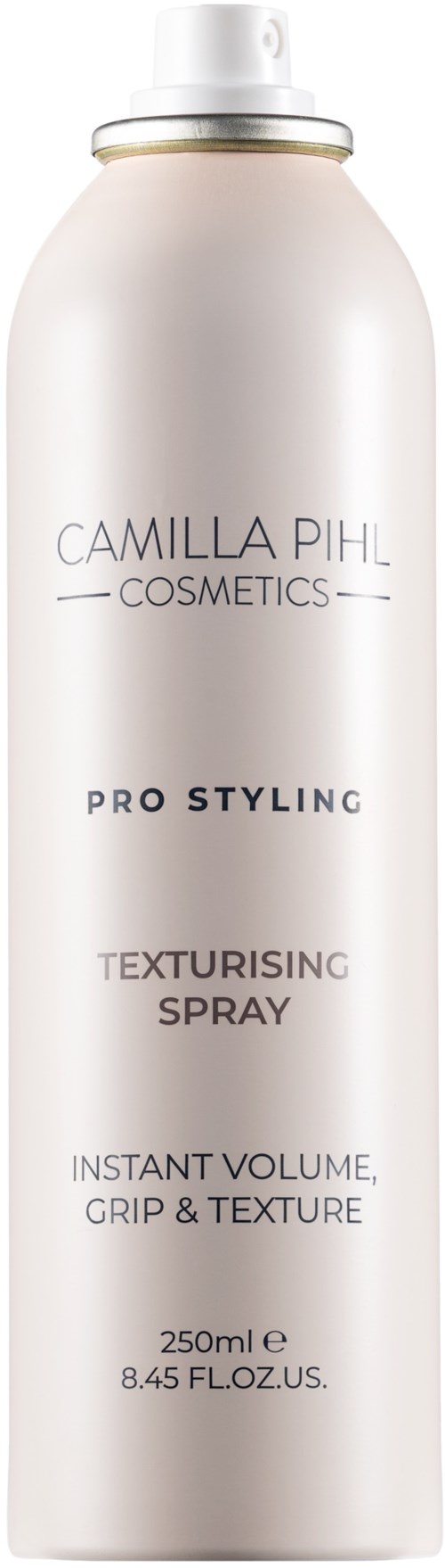 A white spray can with a gold ring near the top, labeled Camilla Pihl Cosmetics Pro Styling Texturising Spray 250ml.