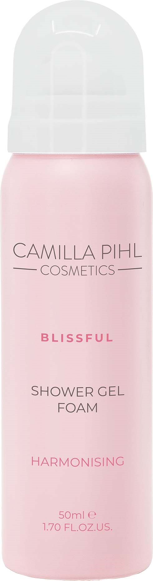 A pink bottle of Camilla Phil Cosmetics Blissful Shower Gel Foam with white cap, promoting harmonizing fragrance.