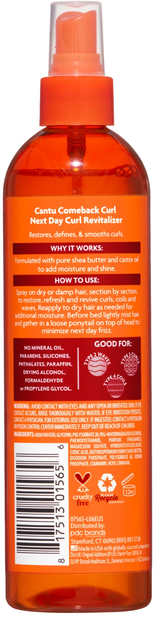 Oranje sprayfles met label over haarcurl en verzorging. Bevat instructies en ingrediënten voor haarverzorging.