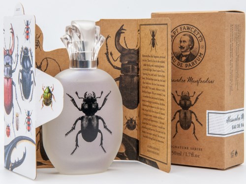 A perfume bottle with a silver cap, surrounded by insect illustrations and a brown box with more insect images.