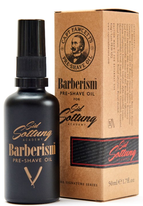 A black bottle and a brown box of pre-shave oil for men, labeled with brand and product details.